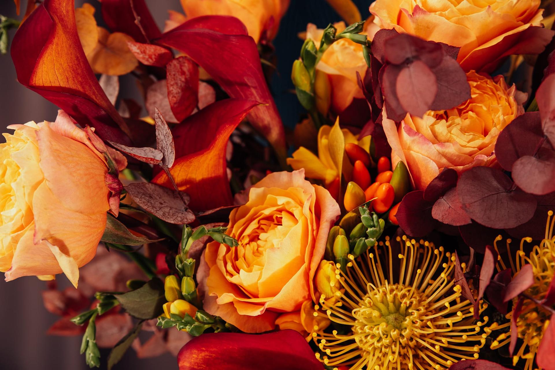 A vibrant autumn bouquet in red, orange and magenta