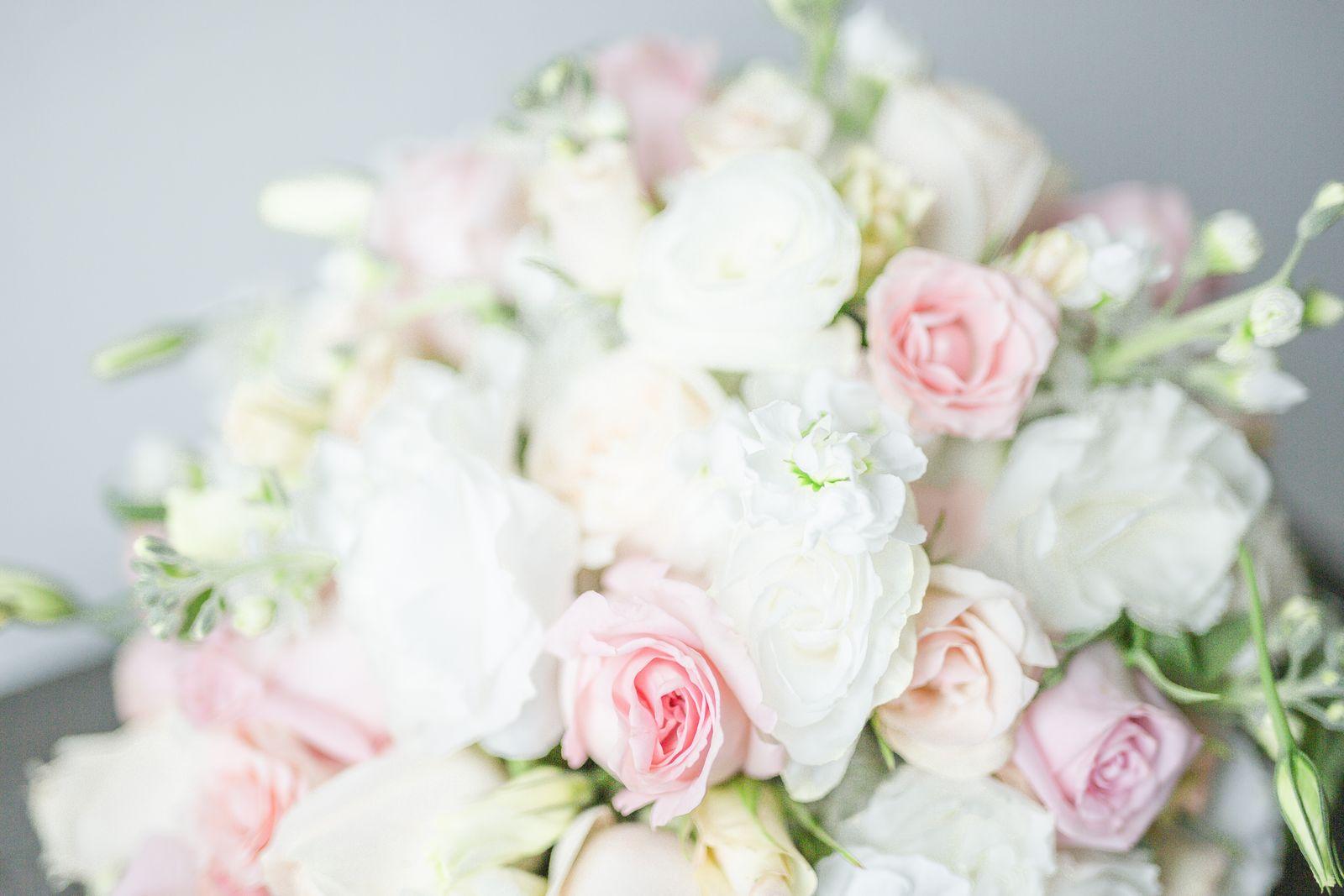 A soft bouquet of pink and white roses