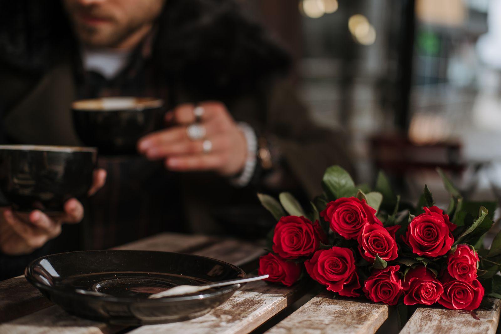 A hand-tied bouquet of roses set on a dinner table